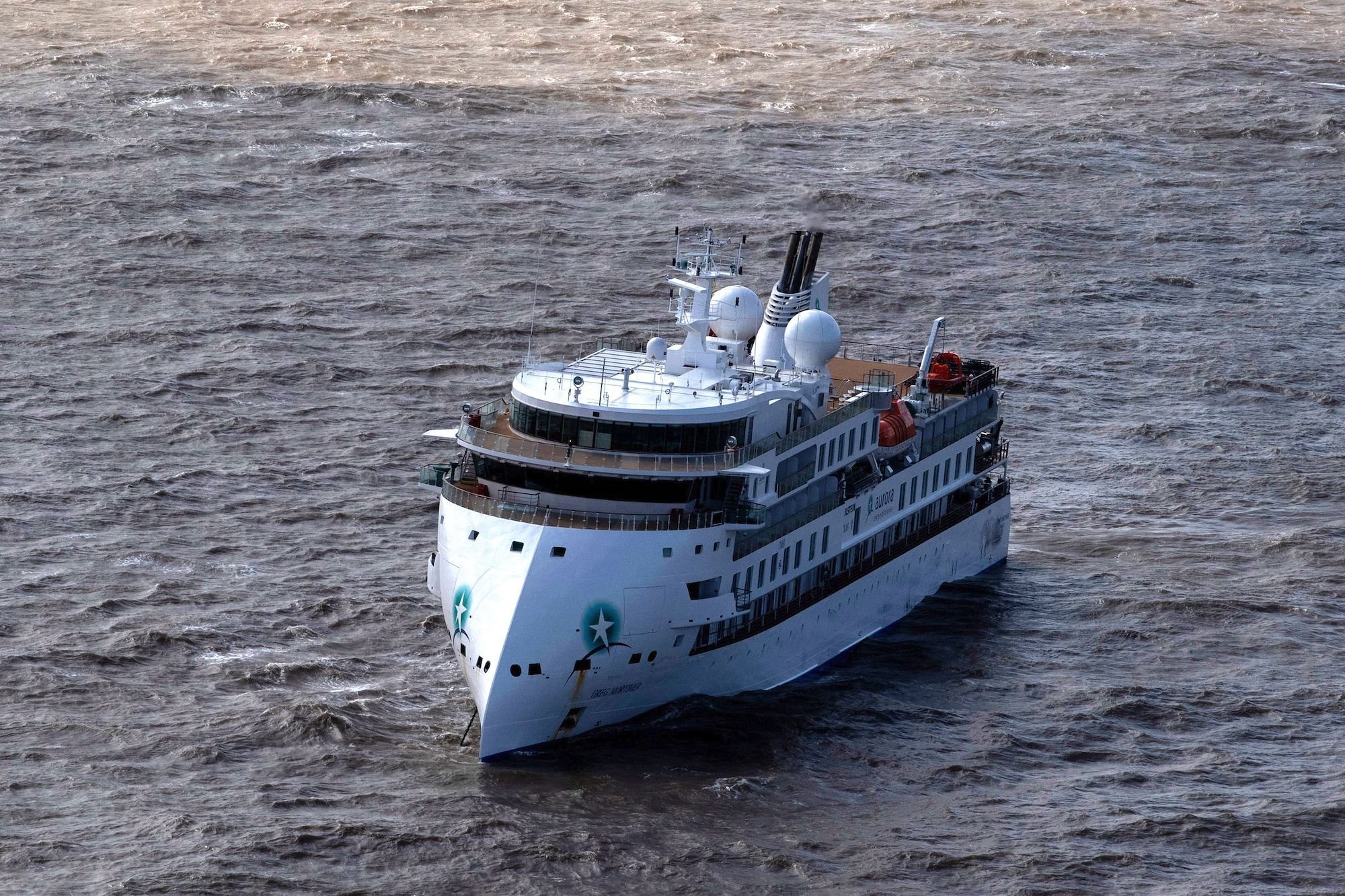 The Greg Mortimer, a cruise liner operated by Australia's Aurora Expeditions, departed March 15 on a voyage to Antarctica and South Georgia. Since the beginning of April, however, the ship has been stuck off the coast of Uruguay, after authorities refused to allow passengers to disembark due to the risk of coronavirus. (Pablo Porciuncula/AFP via Getty Images)