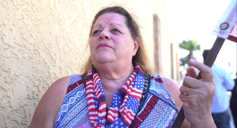 American flag in hand, Becky Walker Fagernes attended a protest on April 17, 2020 in Huntington Beach against stay-at-home orders. (OC Hawk)