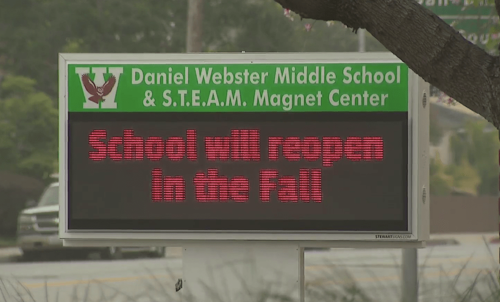 A sign at Daniel Webster Middle School in Sawtelle reads "School will reopen in the Fall" on April 29, 2020. (KTLA)