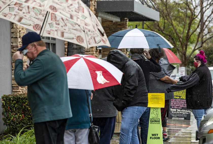 Customers line up outside a Trader Joe’s store in Riverside on April 9, 2020.(Gina Ferazzi / Los Angeles Times)