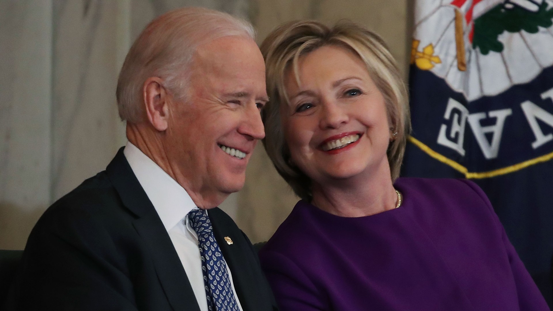 Former US Secretary of State, Hillary Clinton shares a laugh with US Vice President Joseph Biden, during a portrait unveiling ceremony for outgoing Senate Minority Leader Harry Reid (D-NV), on Capitol Hill December 8, 2016 in Washington, DC. (Mark Wilson/Getty Images)