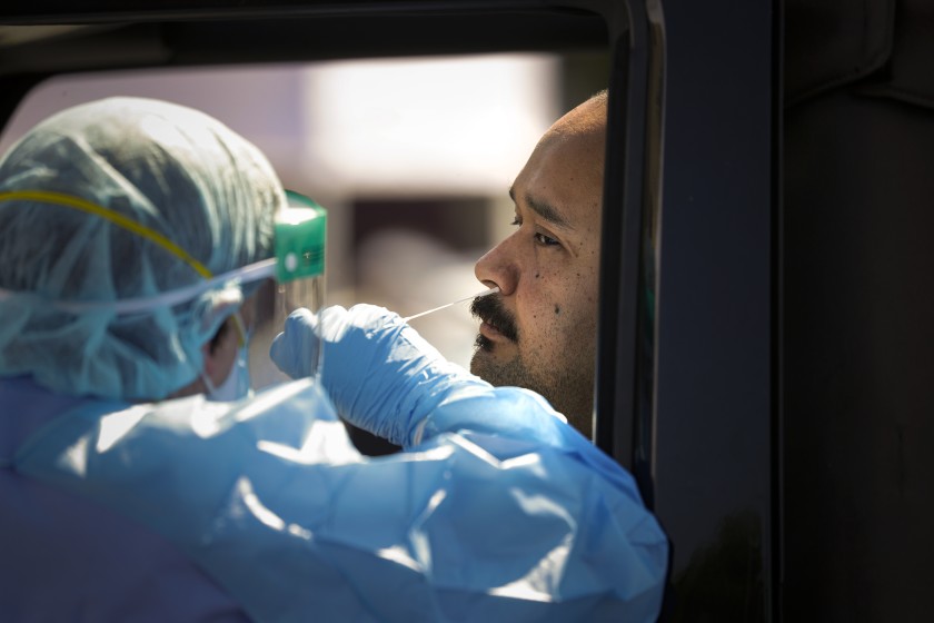 A man is tested for the coronavirus at a drive-through screening center in Montclair in this undated photo. (Credit: Irfan Khan / Los Angeles Times)