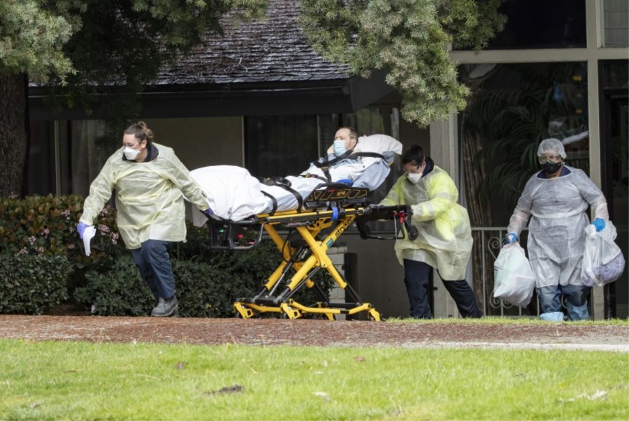 Patients are moved from the Magnolia Rehabilitation and Nursing Center in Riverside after 13 staff members fail to show up for work.(Gina Ferazzi / Los Angeles Times)