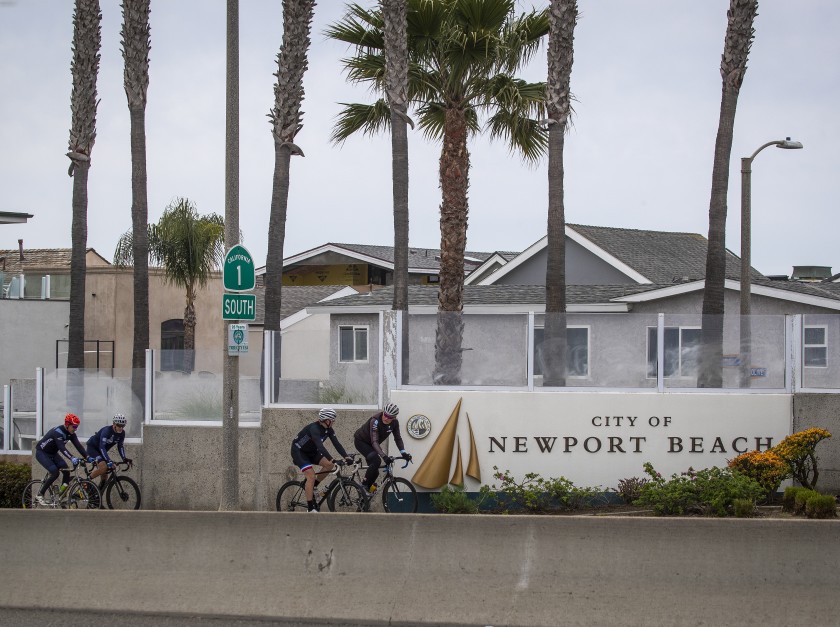 Cyclists have the street to themselves in Newport Beach on March 31, 2020. (Credit: Allen J. Schaben / Los Angeles Times)