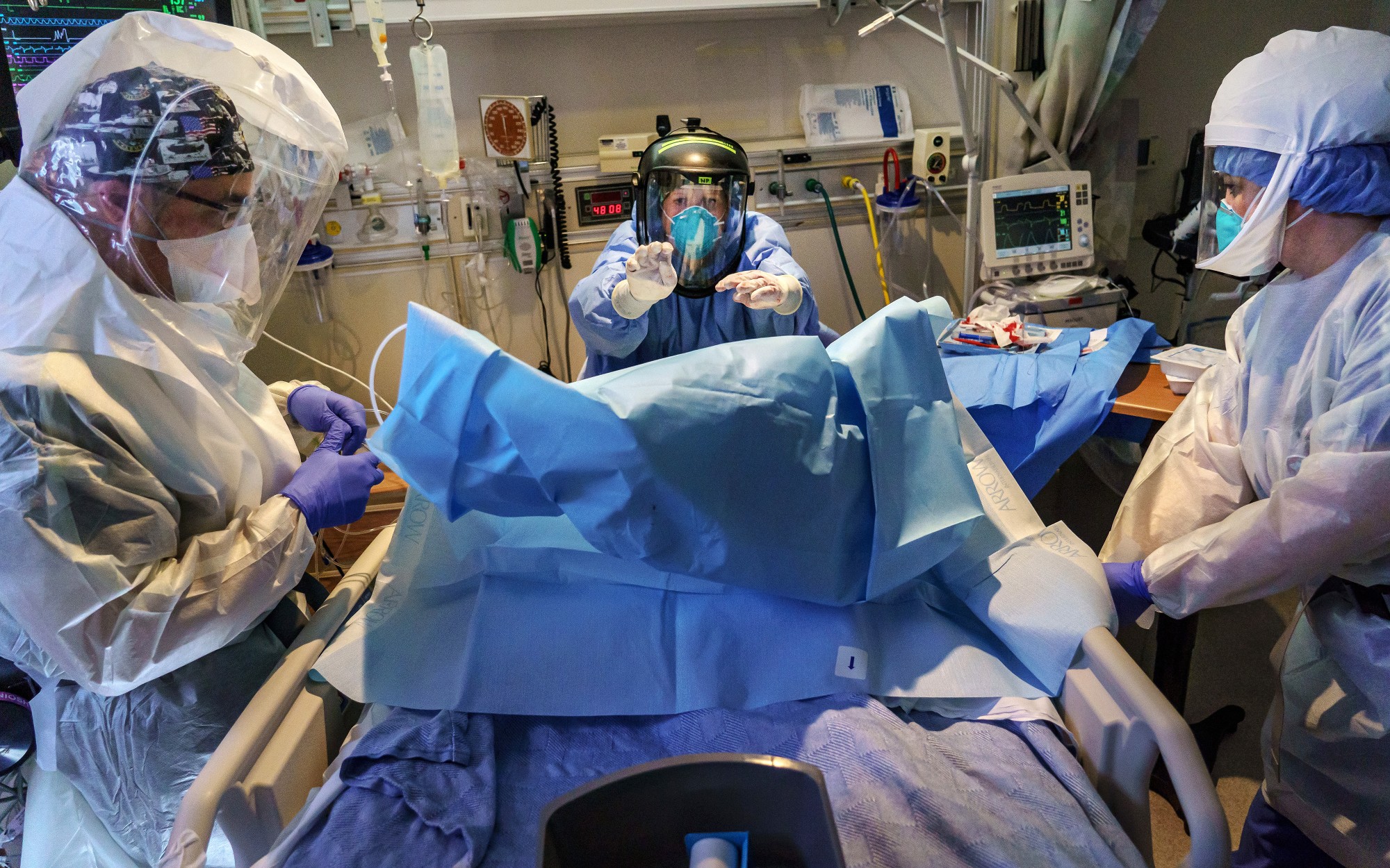 Medical personnel work to stabilize a COVID-19 patient at Scripps Mercy Hospital Chula Vista. (Marcus Yam / Los Angeles Times)