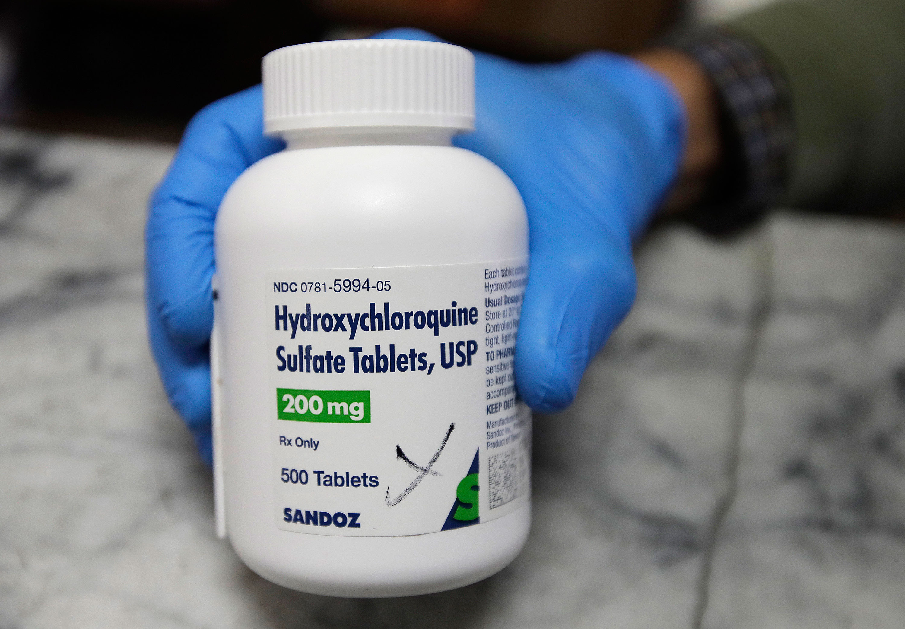 Hydroxychloroquine is an anti-malaria drug that has not been approved by the US Food and Drug Administration to treat coronavirus. (Ben Margot/AP)