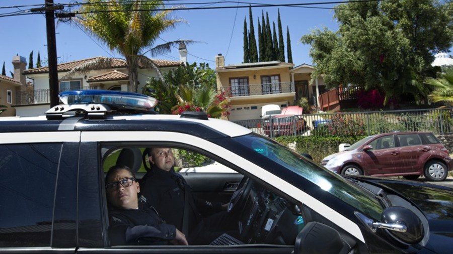 In 2019, Officers Denise Vasquez and Oscar Bocanegra patrol a Tarzana area where a computer program predicted a higher possibility of property crime. (Mel Melcon / Los Angeles Times)