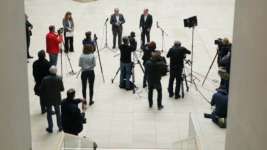 Members of the media are seen practicing social-distancing in this file photo. (Sean Gallup/Getty Images)