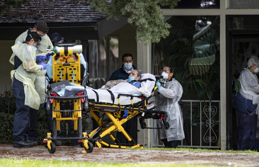 A patient is removed from a Riverside nursing home amid a COVID-19 outbreak in this undated photo. Hospice workers, who frequently visit such facilities, face a shortage of protective equipment. (Gina Ferazzi/Los Angeles Times)