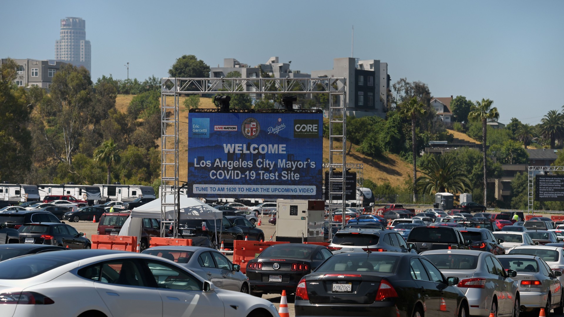 People line up in their cars at a drive-through novel coronavirus testing site to get a free COVID-19 test at the Los Angeles Dodgers stadium parking lot, in Los Angeles, California on May 26, 2020. (Agustin Paullier/AFP/Getty Images)