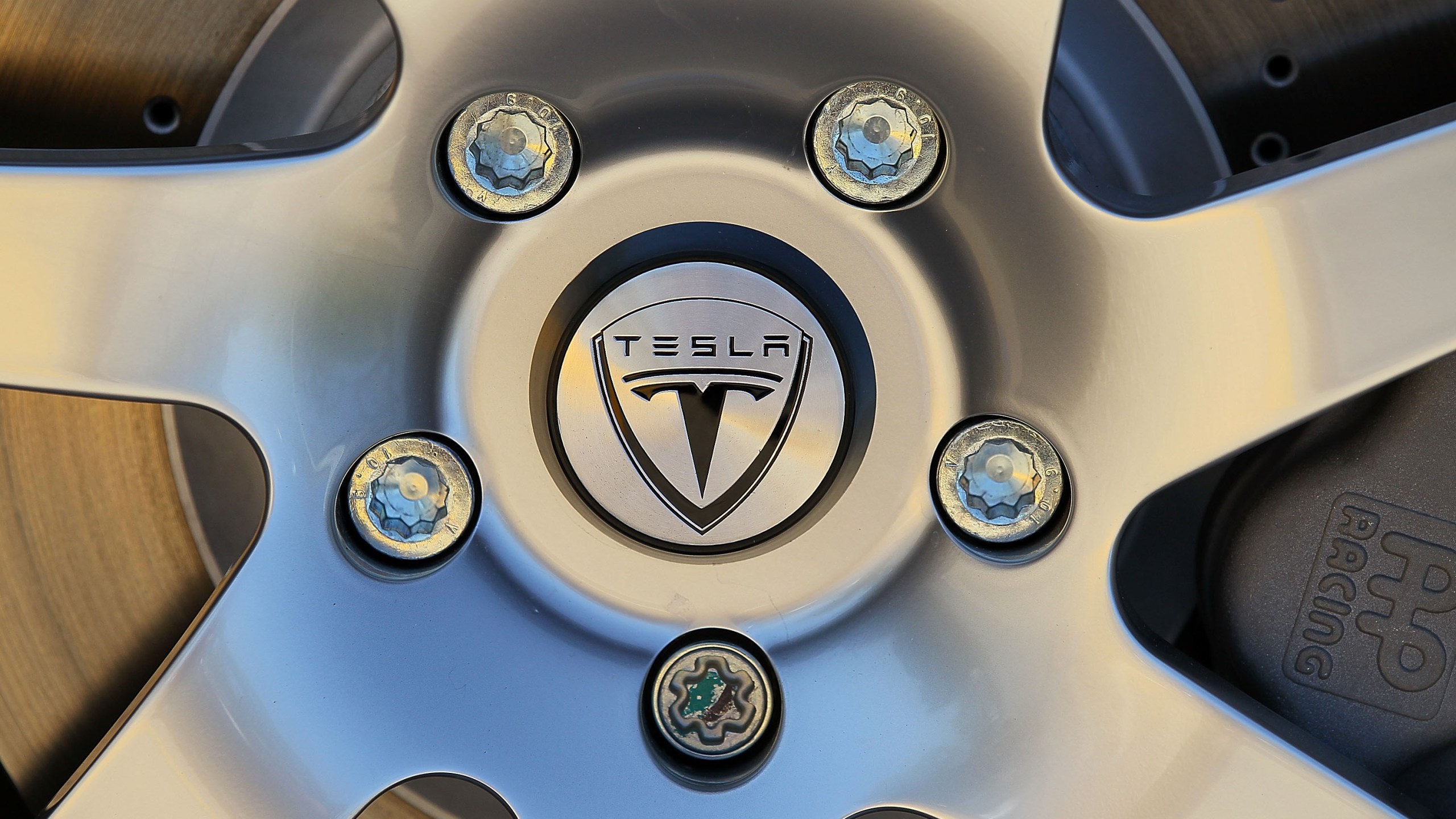 The Tesla Motors logo is seen on the wheel of a car at Tesla Motors headquarters on May 20, 2010 in Palo Alto. (Justin Sullivan/Getty Images)