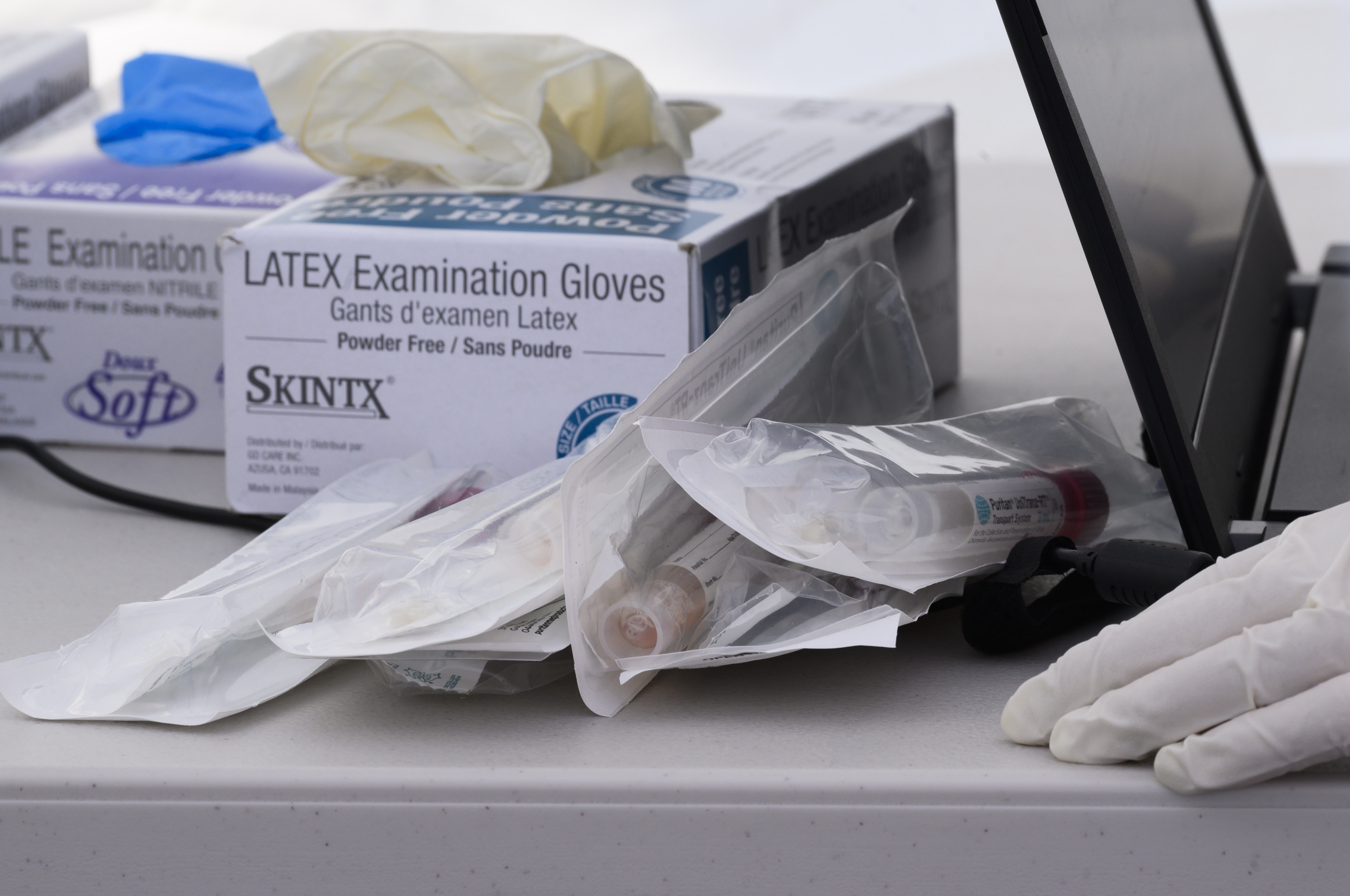 Nasal swab test kits and medical gloves are seen at a COVID-19 testing station in Compton on April 28, 2020. (ROBYN BECK/AFP via Getty Images)