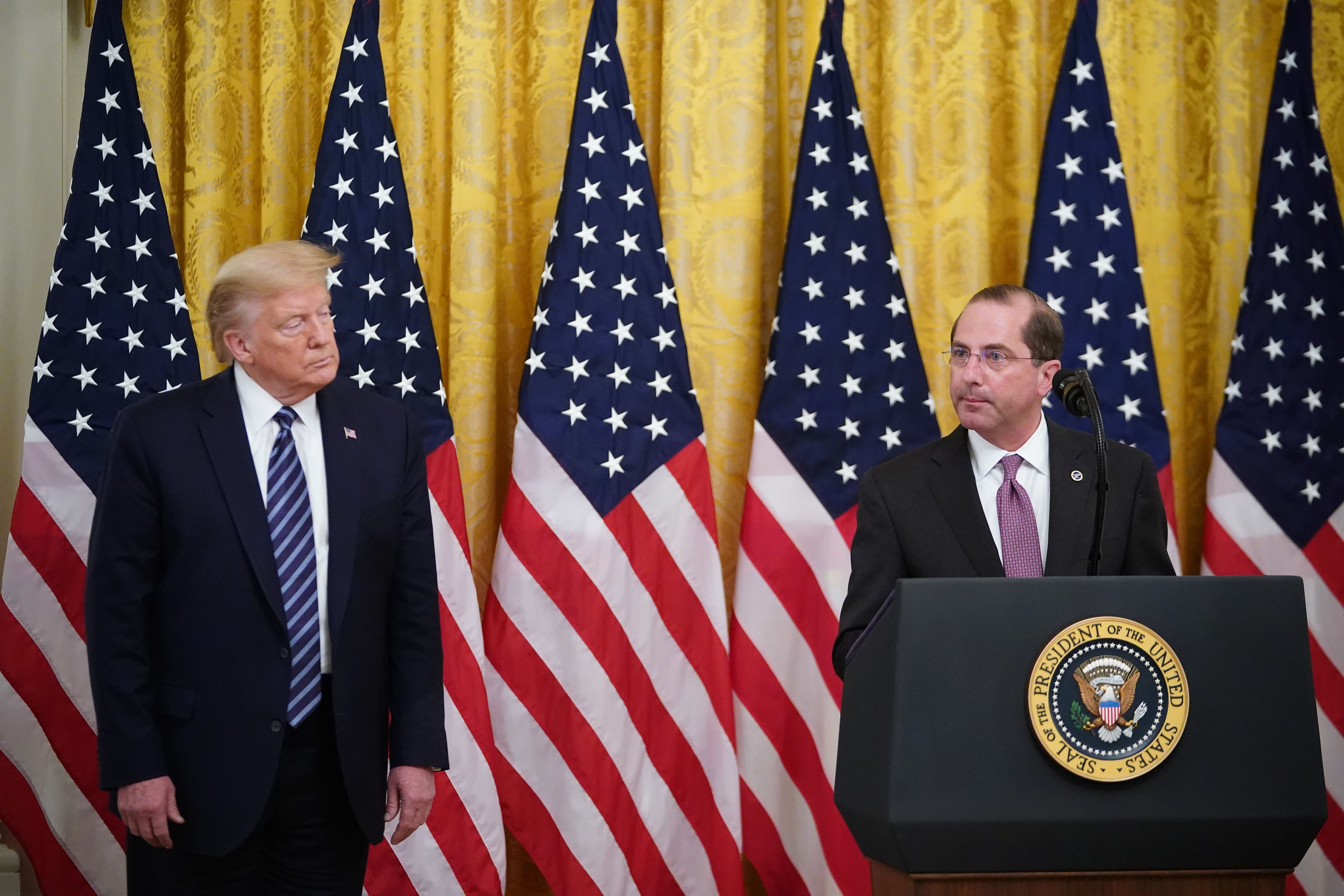 President Donald Trump listens as Secretary of Health and Human Services Alex Azar speaks on protecting Americas seniors from the COVID-19 pandemic in the East Room of the White House in Washington, D.C. on April 30, 2020. (MANDEL NGAN/AFP via Getty Images)