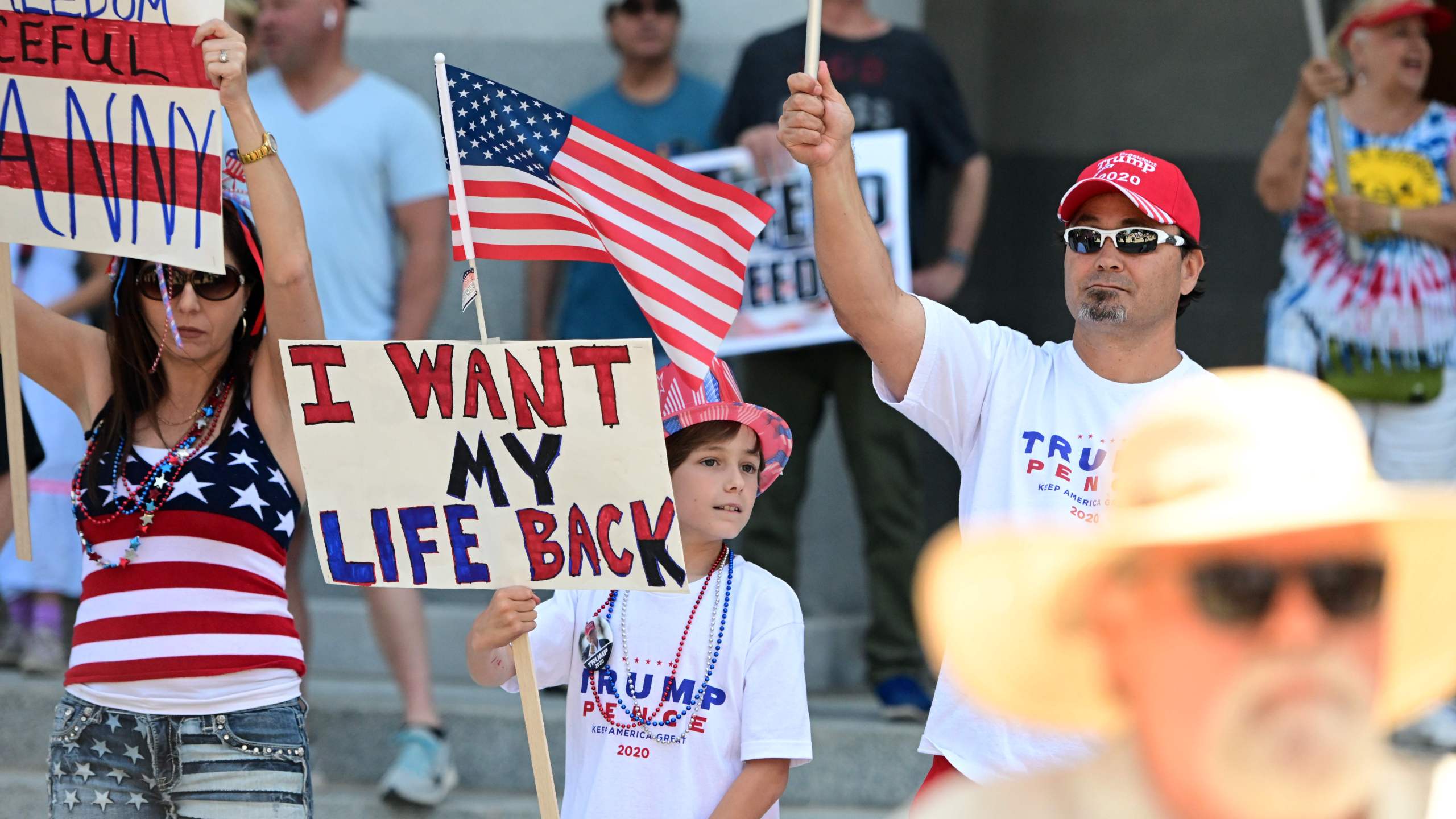 Hundreds of people gather to protest the lockdown in spite of shelter-in-place rules still being in effect at California's state capitol building in Sacramento, California on May 1, 2020. (JOSH EDELSON/AFP via Getty Images)