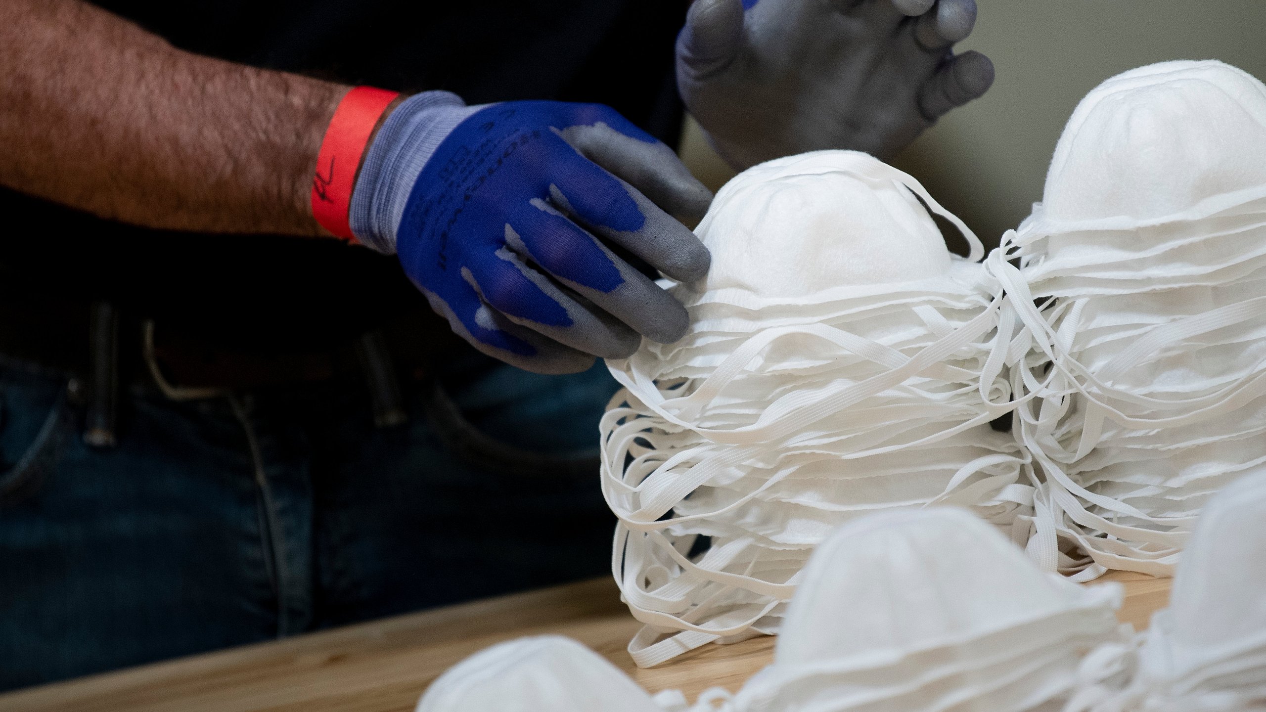 A worker at a Honeywell International factory in Phoenix, Arizona, produces N95 masks on May 5, 2020. (Brendan Smialowski / AFP / Getty Images)