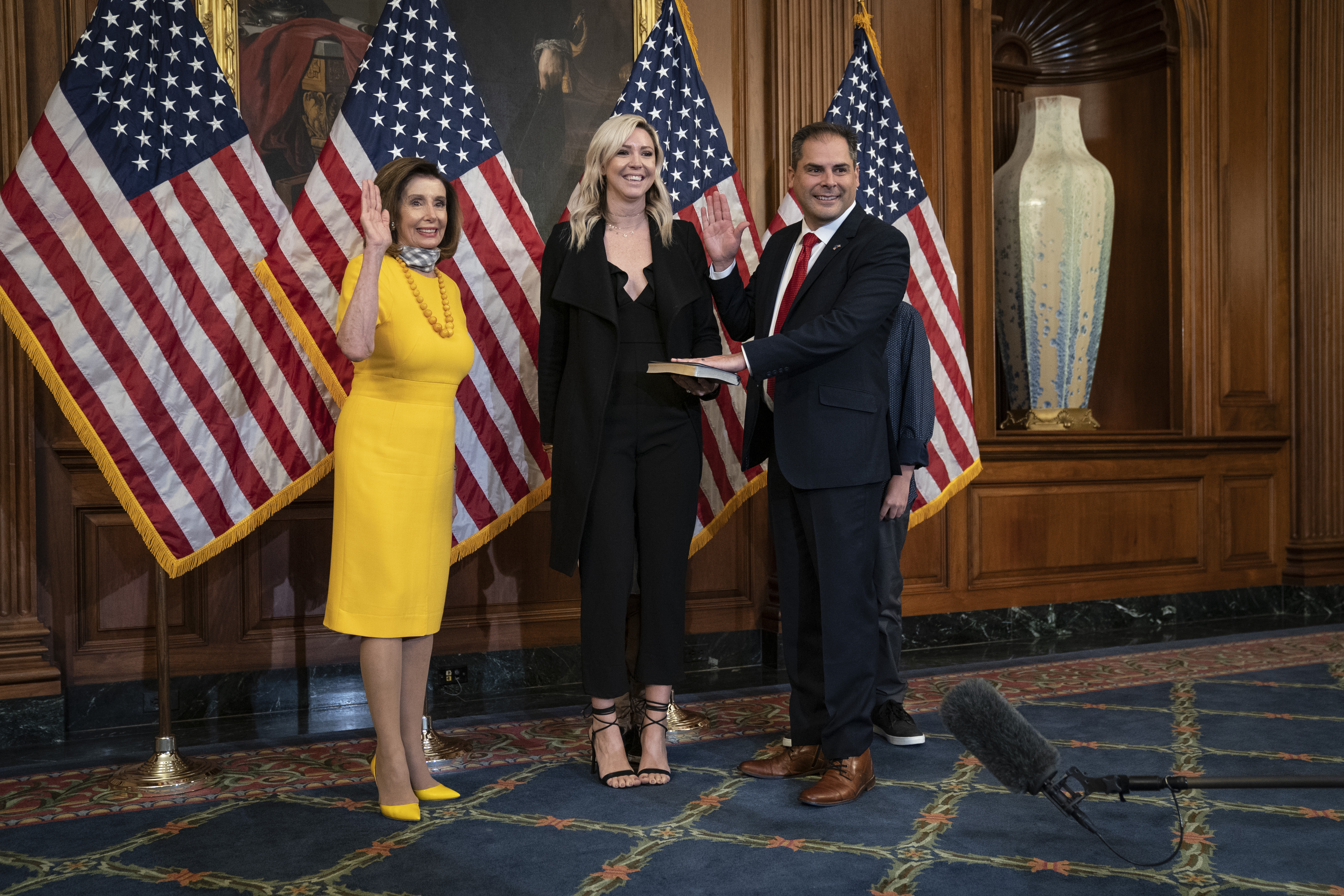 From left: Speaker of the House Nancy Pelosi participates in a ceremonial swearing-in with new Rep. Mike Garcia, with his wife Rebecca, at the U.S. Capitol on May 19, 2020 in Washington, D.C. (Drew Angerer/Getty Images)