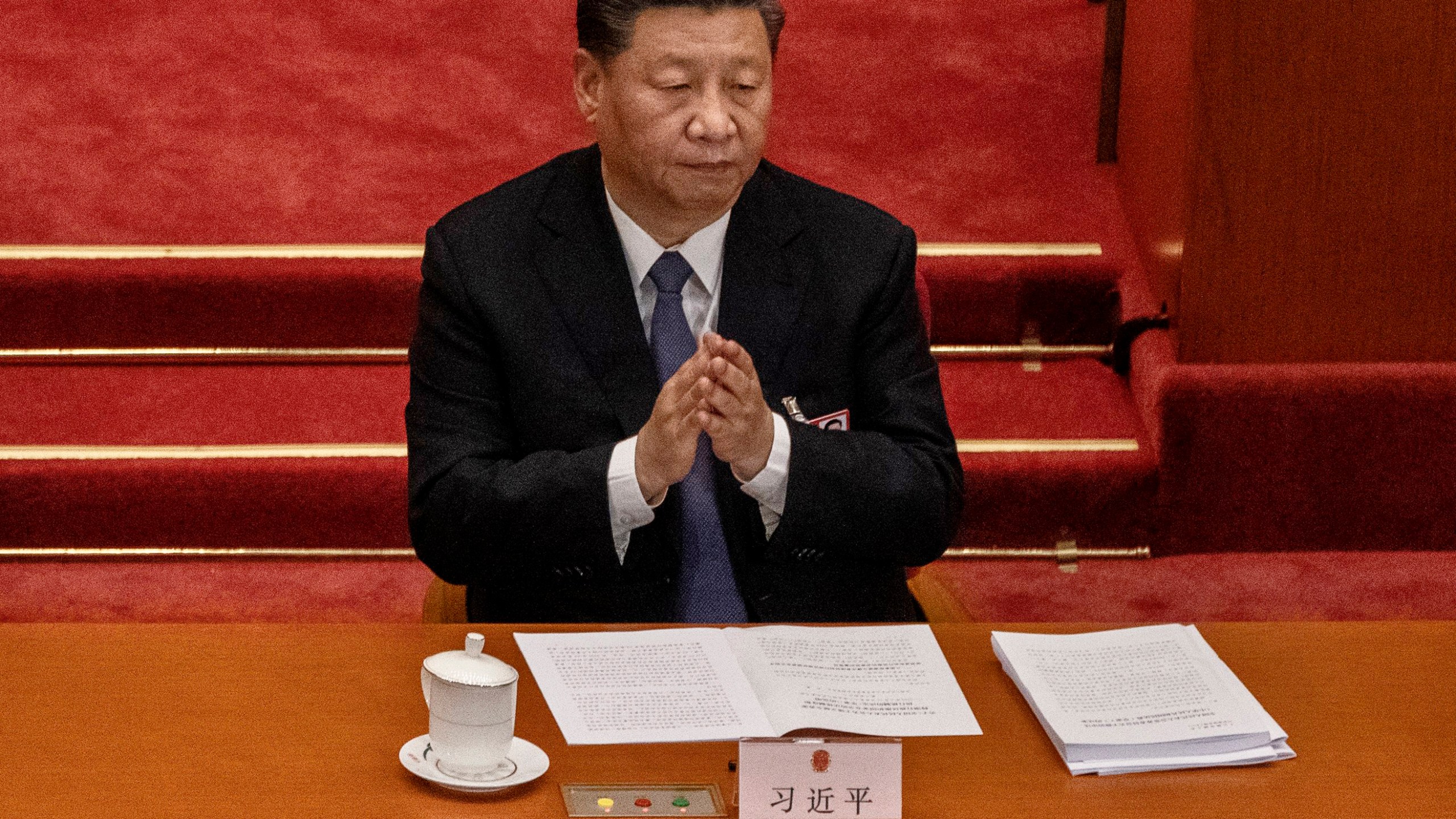 Chinese president Xi Jinping applauds as he listens to a speech at the opening of the National People's Congress at the Great Hall of the People on May 22, 2020 in Beijing, China. (Kevin Frayer/Getty Images)