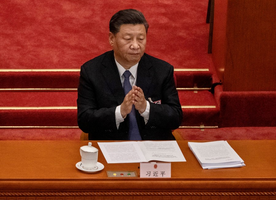 Chinese president Xi Jinping applauds as he listens to a speech at the opening of the National People's Congress at the Great Hall of the People on May 22, 2020 in Beijing, China. (Kevin Frayer/Getty Images)