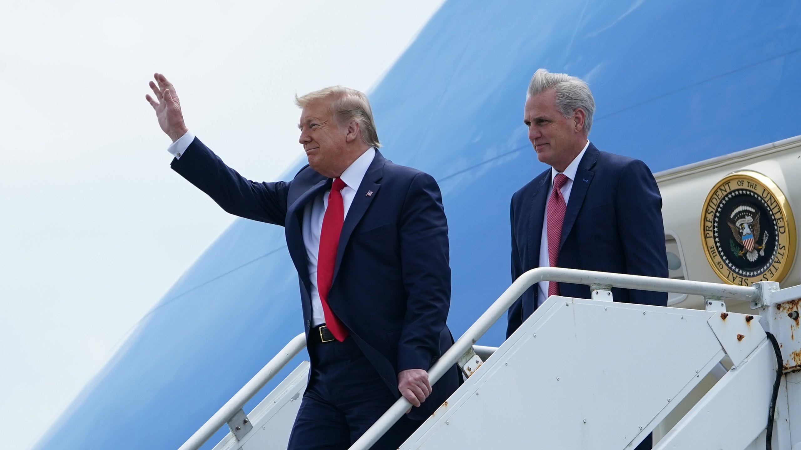 U.S. President Donald Trump waves as he arrives with U.S. Rep. Kevin McCarthy(R-CA), who looks on at Cape Canaveral, Fla., on May 30, 2020.(MANDEL NGAN/AFP via Getty Images)