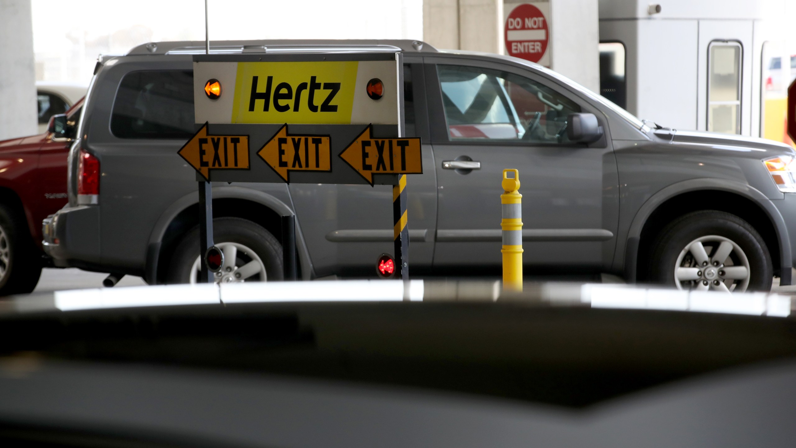 A sign is posted at the Hertz Rent-A-Car rental lot at San Francisco International Airport on April 30, 2020, in San Francisco, California. (Justin Sullivan/Getty Images)