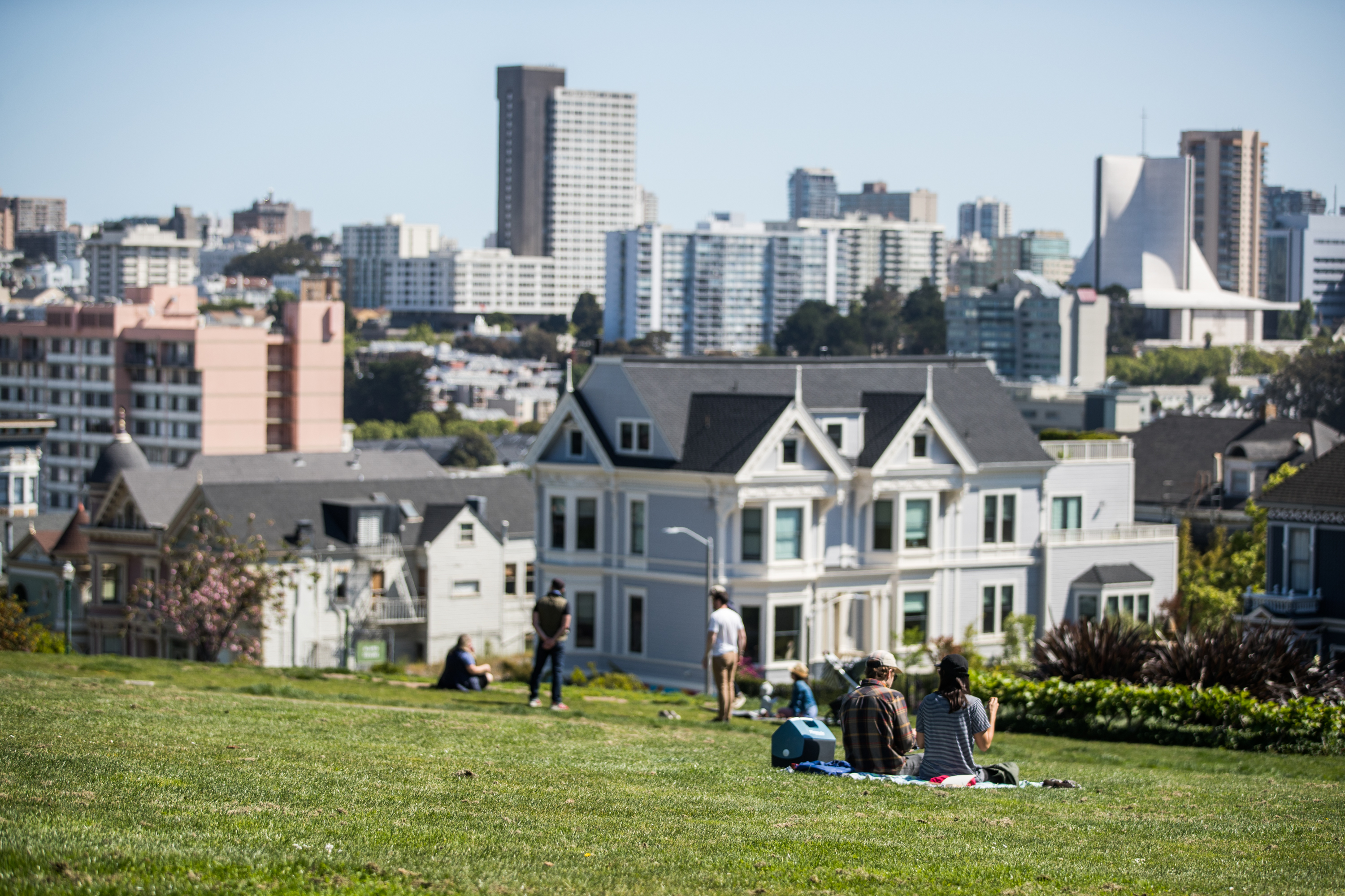 People sit on the grass at Alamo Square Park during the coronavirus pandemic on May 3, 2020 in San Francisco. (Rich Fury/Getty Images)