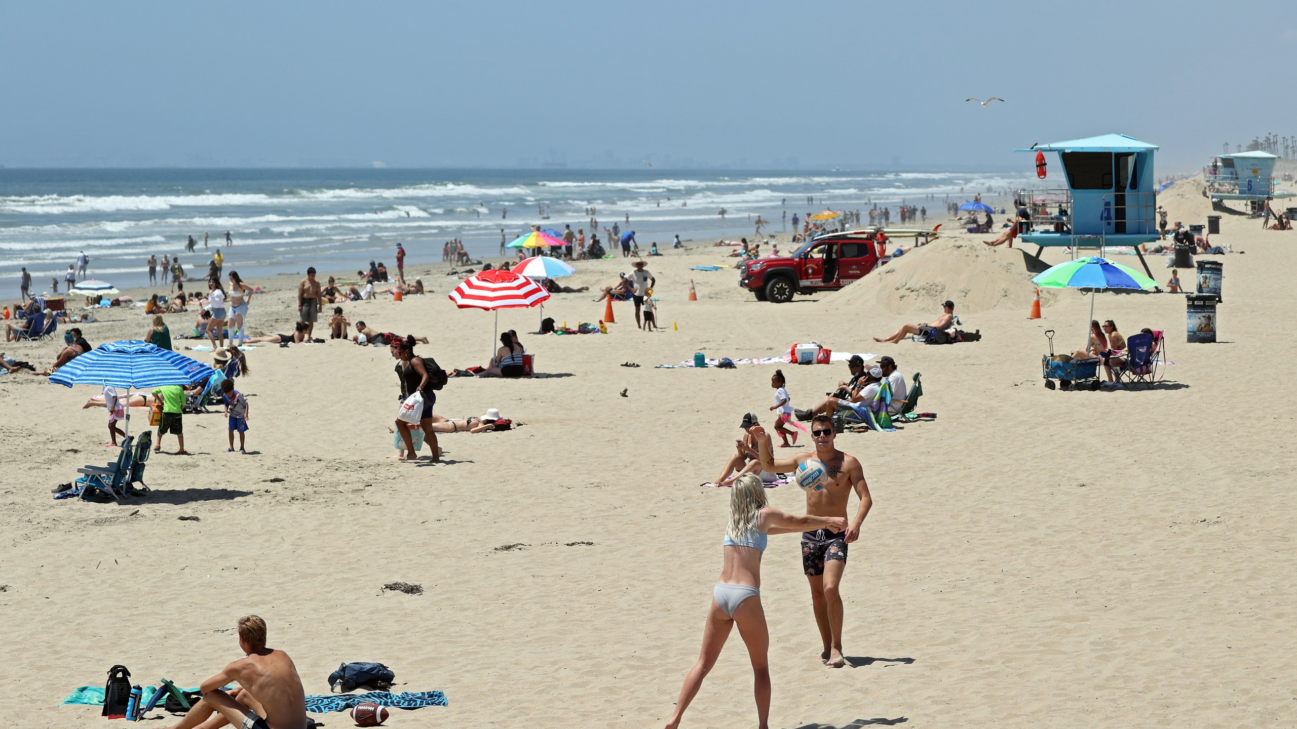 People gather at the beach amid the coronavirus pandemic on May 15, 2020 in Huntington Beach, California. (Michael Heiman/Getty Images)