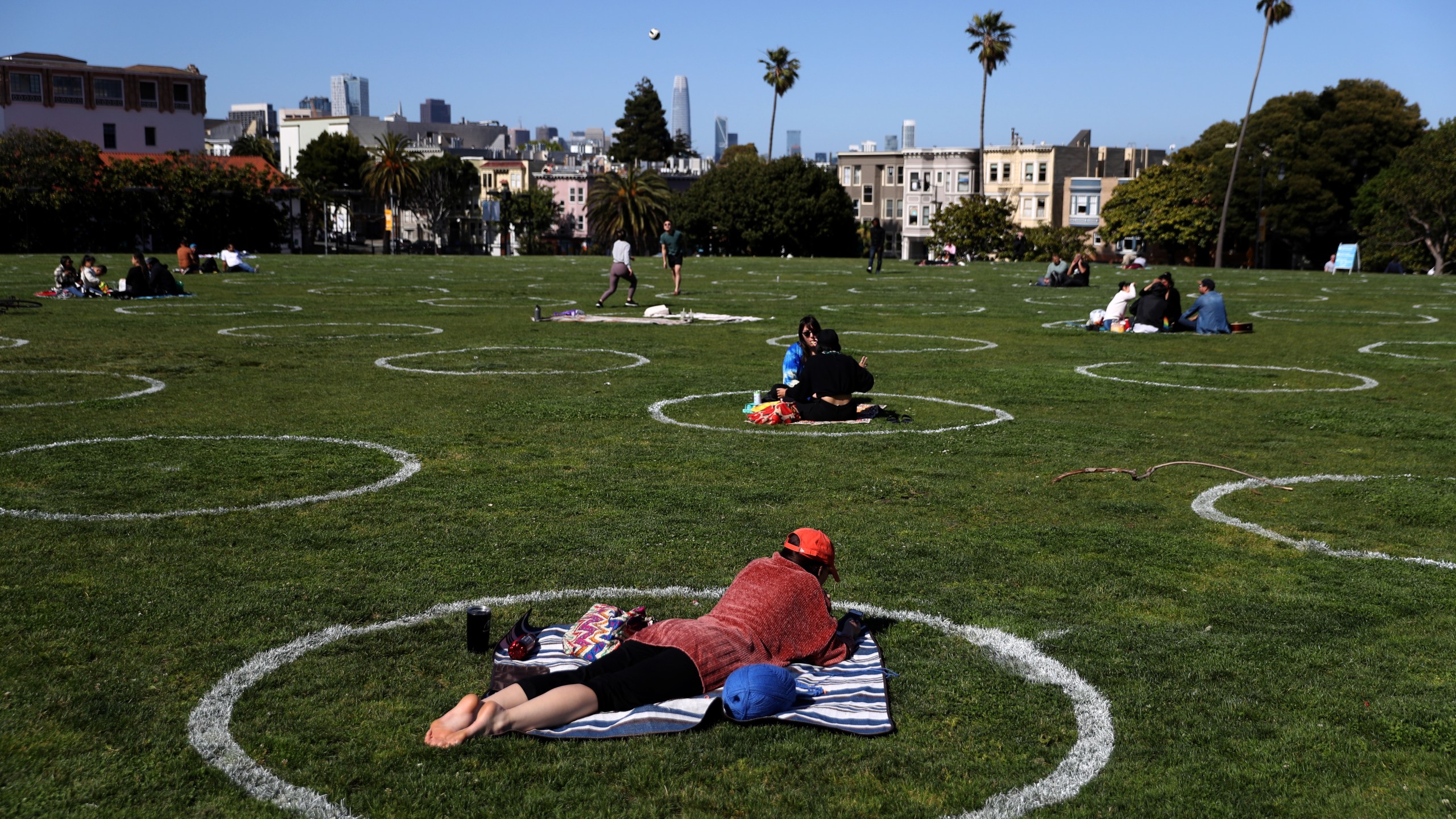 People sit in social distancing circles at Dolores Park on May 20, 2020, in San Francisco, California. (Justin Sullivan/Getty Images)