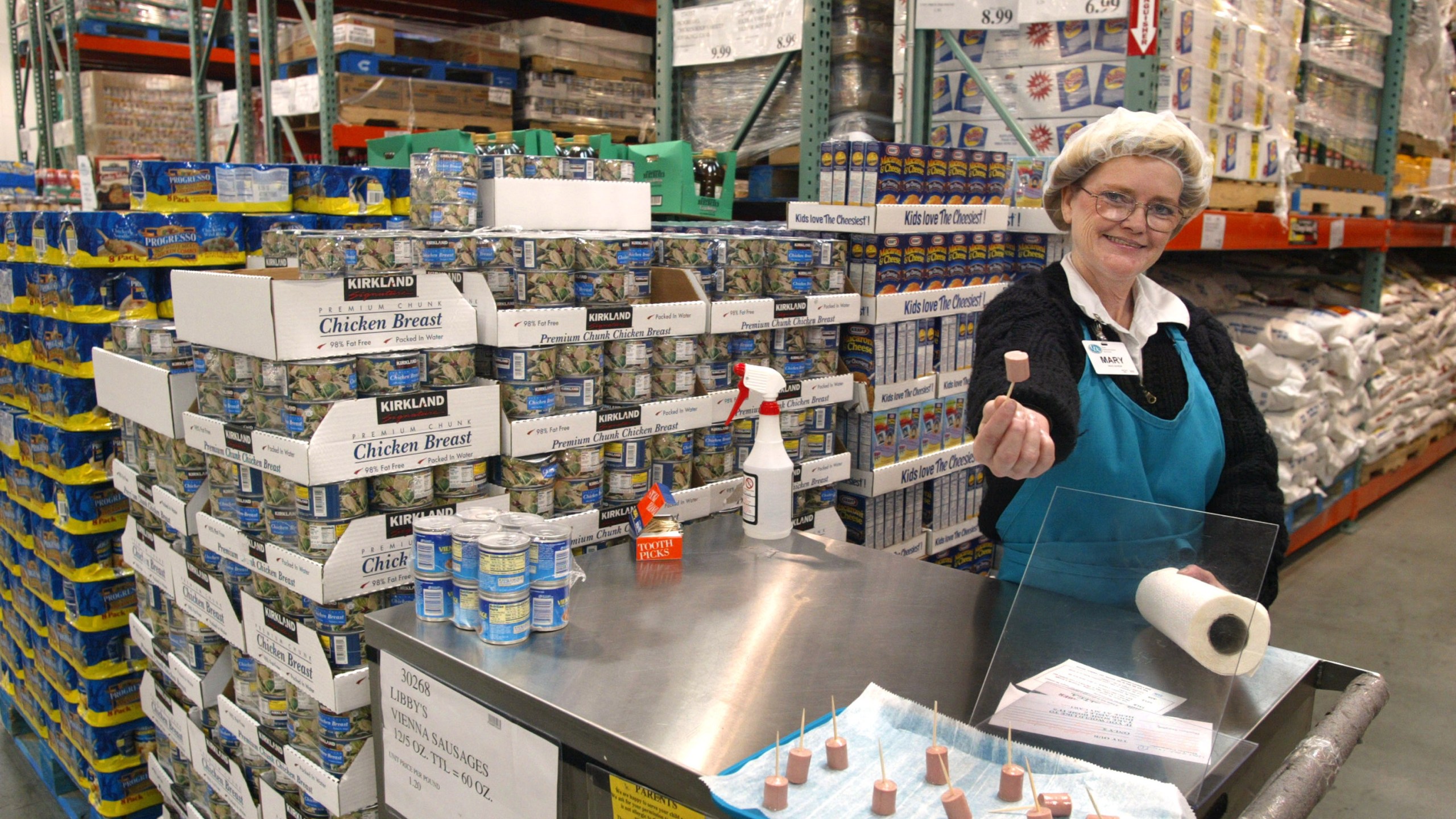 Mary LaRocca offers a sample of Libby's Vienna Sausage in a Costco Wholesale store March 8, 2002 in Niles, Illinois. (Tim Boyle/Getty Images)