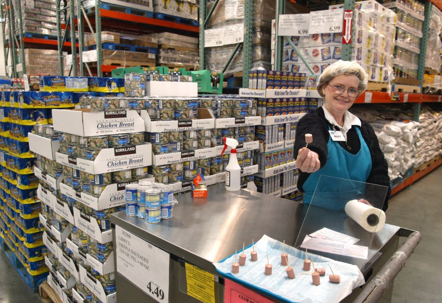 Mary LaRocca offers a sample of Libby's Vienna Sausage in a Costco Wholesale store March 8, 2002 in Niles, Illinois. (Tim Boyle/Getty Images)