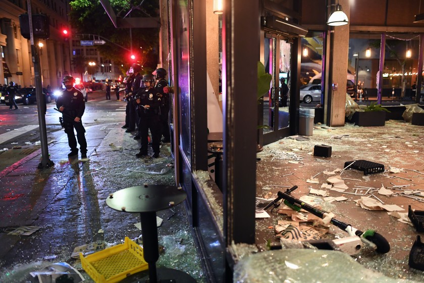 A Starbucks is looted along Spring Street in downtown Los Angeles on May 29, 2020. (Wally Skalij/Los Angeles Times)