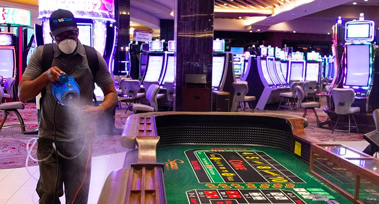 A man sanitizes a table at the Sycuan Casino Resort in El Cajon in a photo posted to the casino's Facebook page on May 7, 2020.