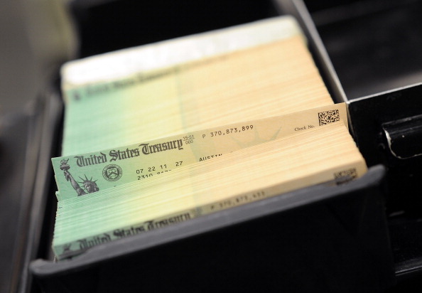 U.S. Treasury checks are piled at the U.S. Treasury printing facility. (William Thomas Cain/Getty Images)