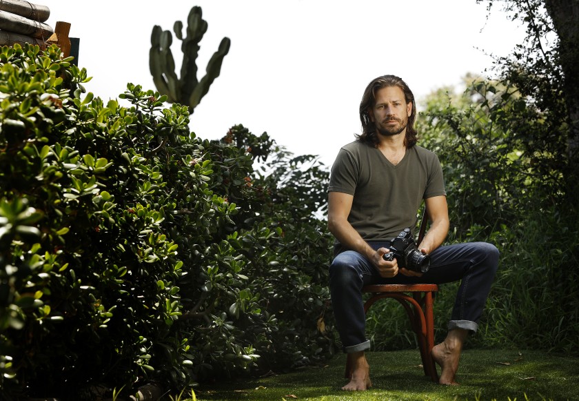 Freelance commercial photographer Kyle Petrozza at his home in Los Angeles. “For folks having to deal with this, it has been insanely frustrating,” he said.(Christina House / Los Angeles Times)