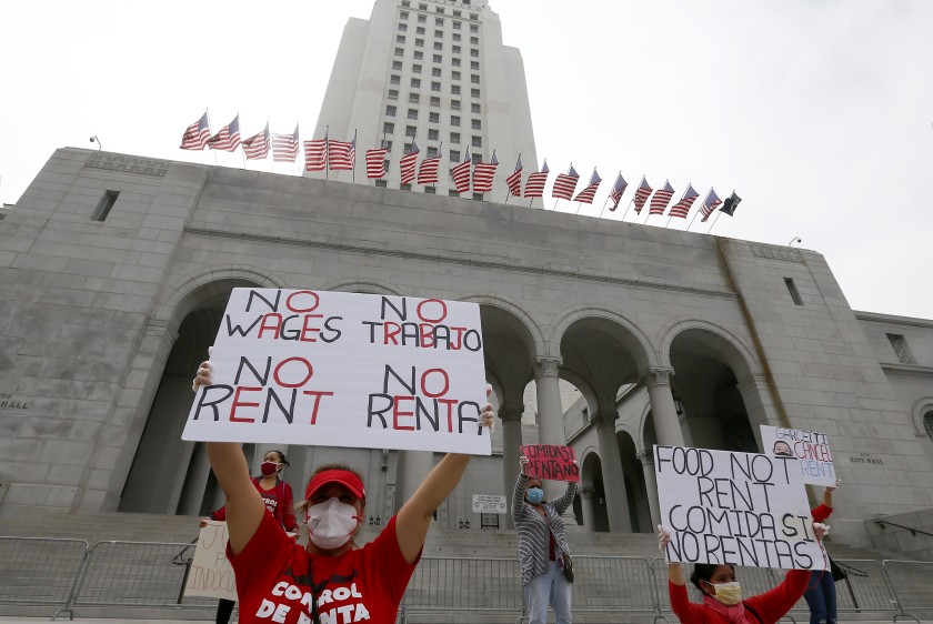 Amid the COVID-19 pandemic, which has led to the city of L.A. being mostly shut down, tenants and their supporters gather outside L.A. City Hall on April 30, 2020, to demand the local government cancel rent and mortgage payments during the coronavirus crisis. (Luis Sinco / Los Angeles Times)