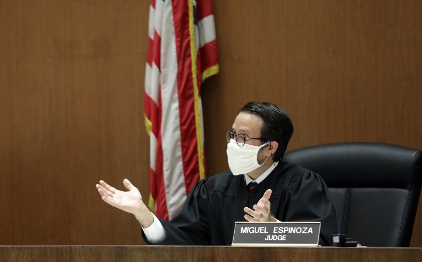 Los Angeles Superior Court Judge Miguel Espinoza holds arraignments in his courtroom via video at Clara Shortridge Foltz Criminal Justice Center on April 21 in Los Angeles.(Myung J. Chun/Los Angeles Times)