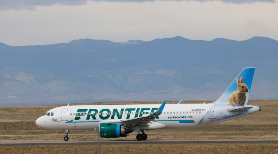 A Frontier Airlines jetl taxis for takeoff from Denver International Airport in Denver. (AP Photo/David Zalubowski)