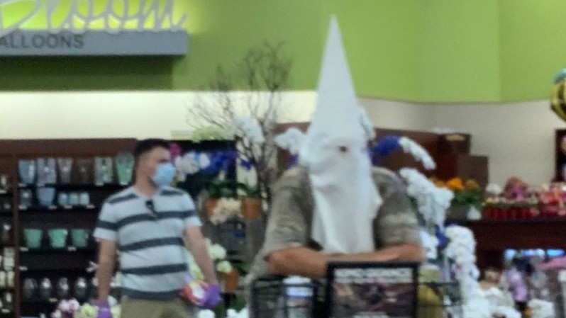 A man seen wearing a KKK hood in a California grocery store will not face any charges. (Alisa Wentzel via CNN Wire)