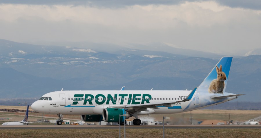 A Frontier Airlines jetliner taxis to a runway to take off from Denver International Airport Thursday, April 23, 2020, in Denver. *David Zalubowski/AP via CNN Wire)