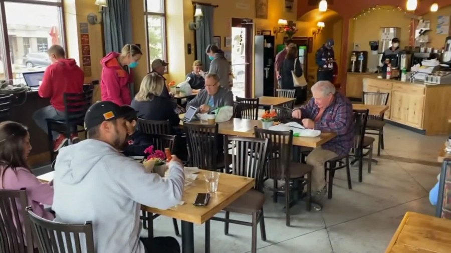 An image taken from video shows many people, mostly without masks, crowded into a Colorado restaurant on Mothers Day. (KCNC via CNN Wire)