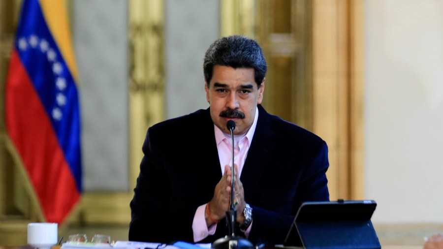 A picture released by his office shows Venezuelan President Nicolás Maduro speaking from the presidential palace in Caracas during a televised announcement on March 26, 2020, after the U.S. indicted him for "narco-terrorism." (Credit: Jhonn Zerpa / Venezuelan Presidency / AFP / Getty Images)