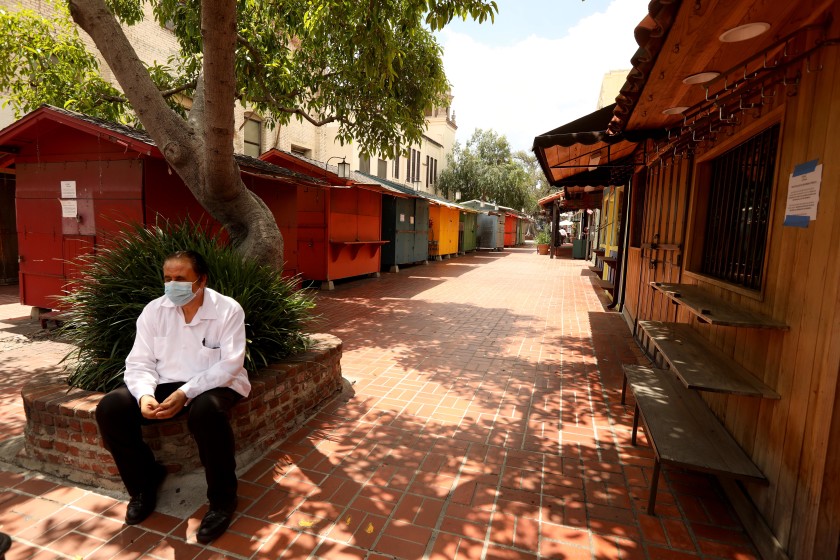 “We’re talking about no business,” Guillermo Garcia, 61, said of the shuttered Olvera Street. Garcia owns the restaurant La Noche Buena and the store Memo’s Place at the popular tourist spot. (Genaro Molina / Los Angeles Times)