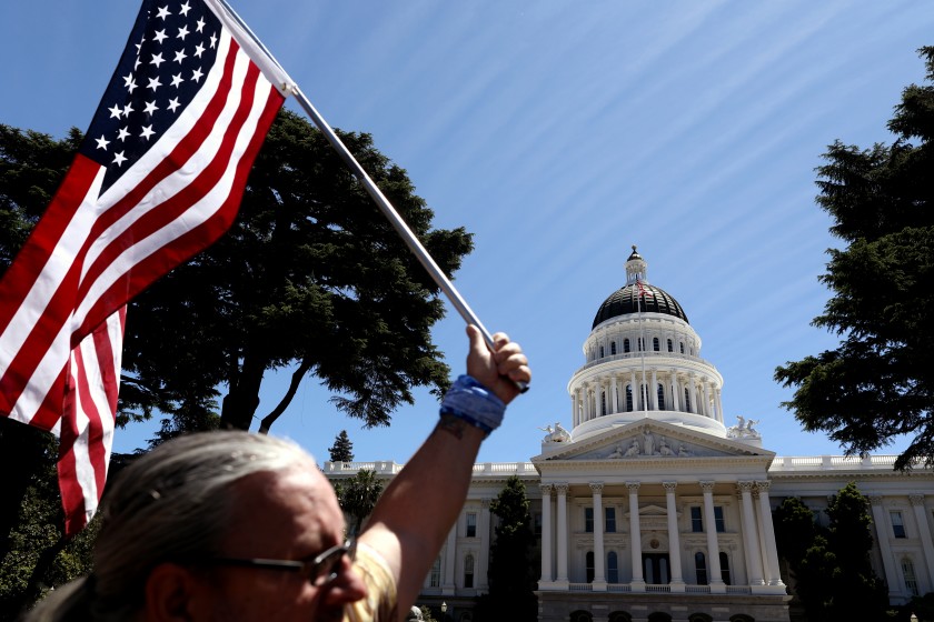 A crowd of roughly 2,000 gathered on May 23, 2020 for “Liberty Fest,” hosted by the Freedom Angels, outside the closed California Capitol in Sacramento. (Gary Coronado / Los Angeles Times)