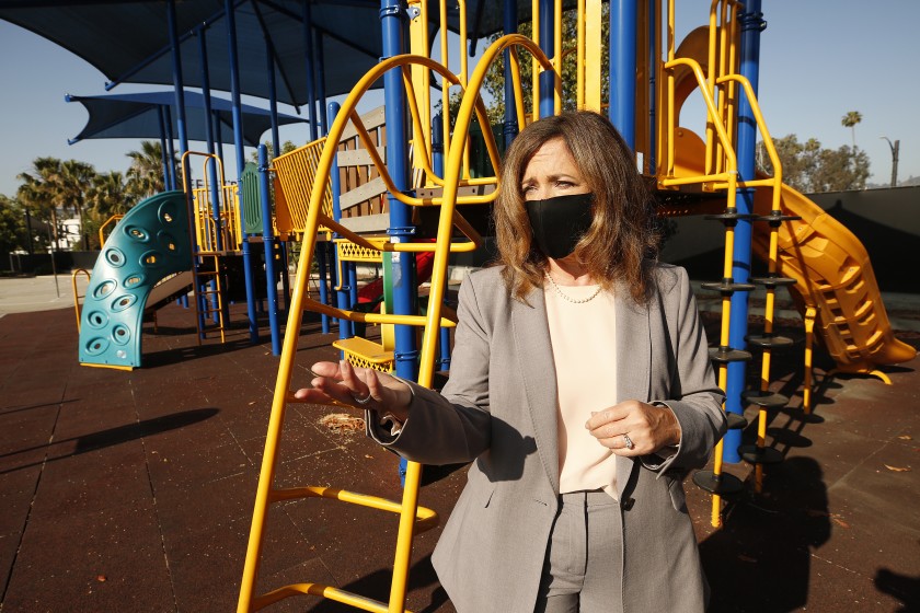 In this May 2020 photo, L.A. County Office of Education Superintendent Debra Duardo explains that a play structure at Cerritos Elementary in Glendale would be off-limits to students under current health directives when the school reopens. (Al Seib / Los Angeles Times)