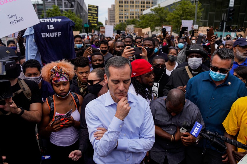 L.A. Mayor Eric Garcetti walks out to address protesters and clergy members on June 2, 2020. (Kent Nishimura / Los Angeles Times)