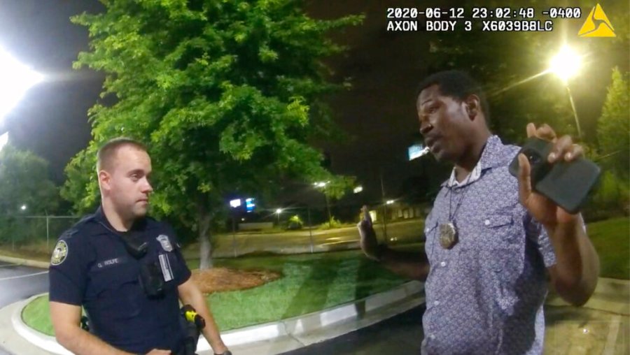 This screen grab taken from body camera video provided by the Atlanta Police Department shows Rayshard Brooks speaking with Officer Garrett Rolfe in the parking lot of a Wendy's restaurant in Atlanta on June 12, 2020.