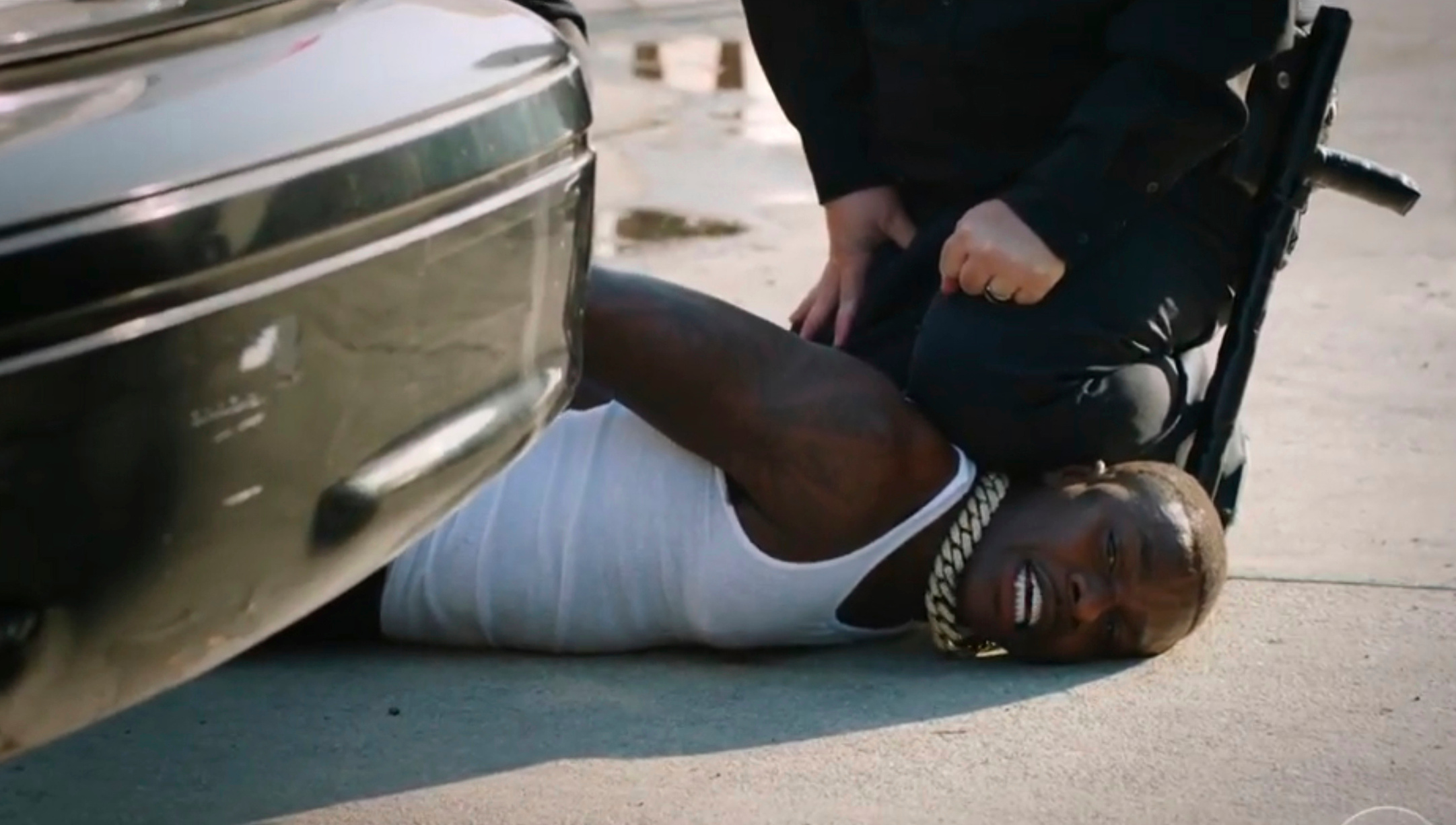 In this video grab issued Sunday, June 28, 2020, by BET, rapper DaBaby performs "Rockstar" as an actor playing a police officer presses his knee on DaBaby's neck, replicating the last few moments of George Floyd's life, during the BET Awards. (BET via AP)