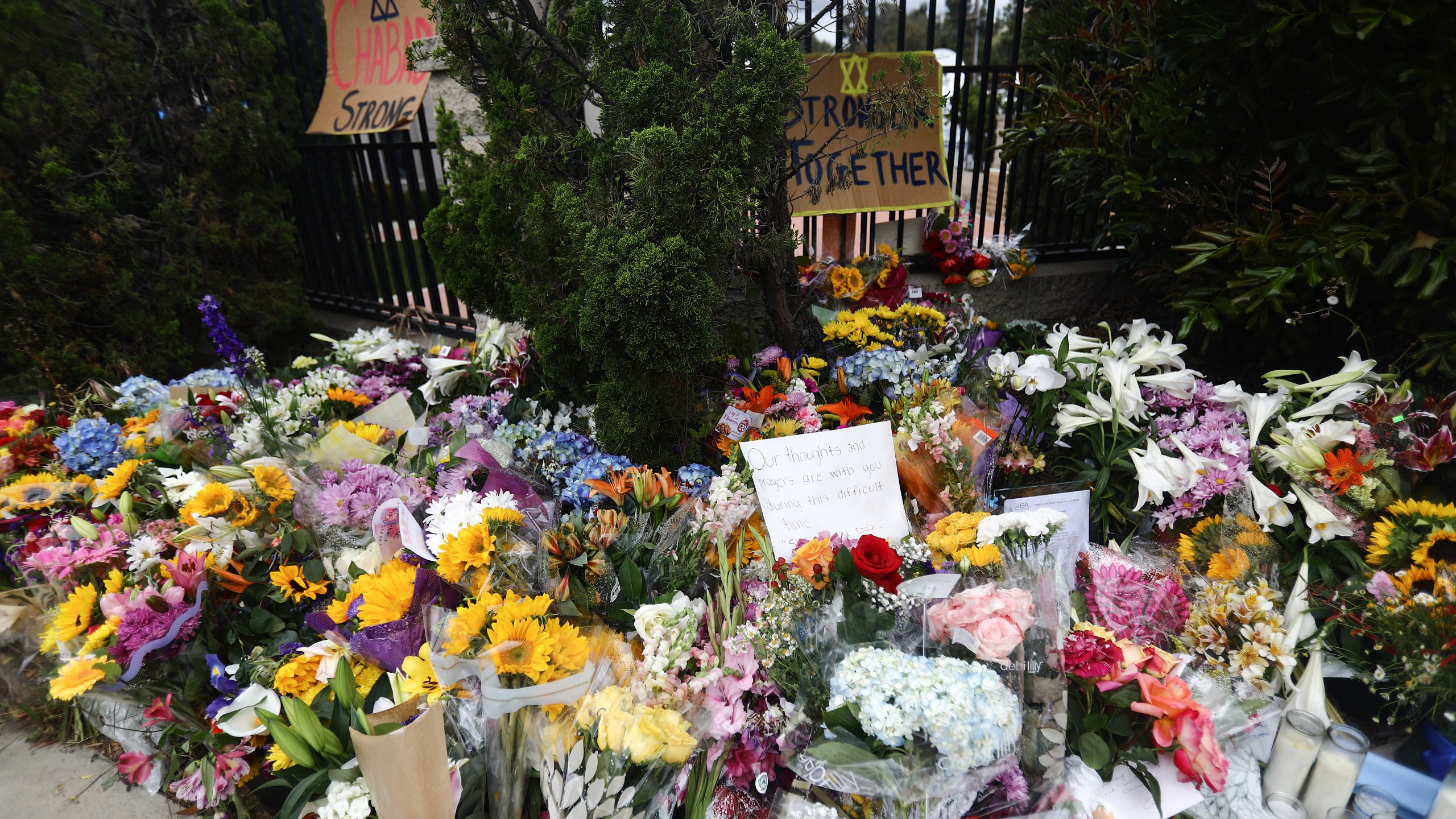 Flowers and mementos are left outside the funeral for Lori Gilbert Kaye, who was killed inside the Chabad of Poway synagogue by a gunman who opened fire during services, on April 29, 2019. (Mario Tama/Getty Images)