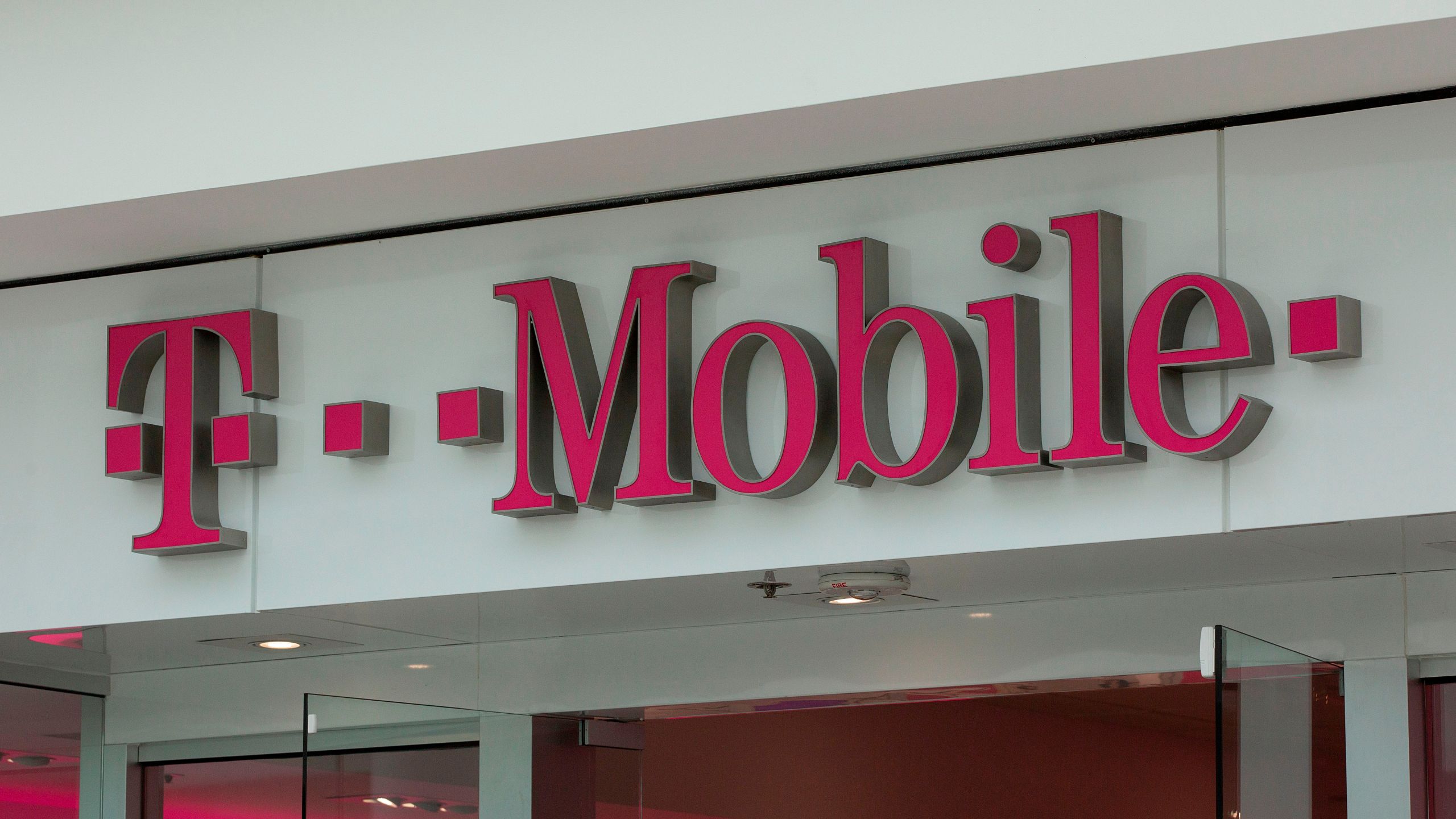 The T-Mobile logo is seen outside a shop in Washington, DC, on July 26, 2019. (ALASTAIR PIKE/AFP via Getty Images)