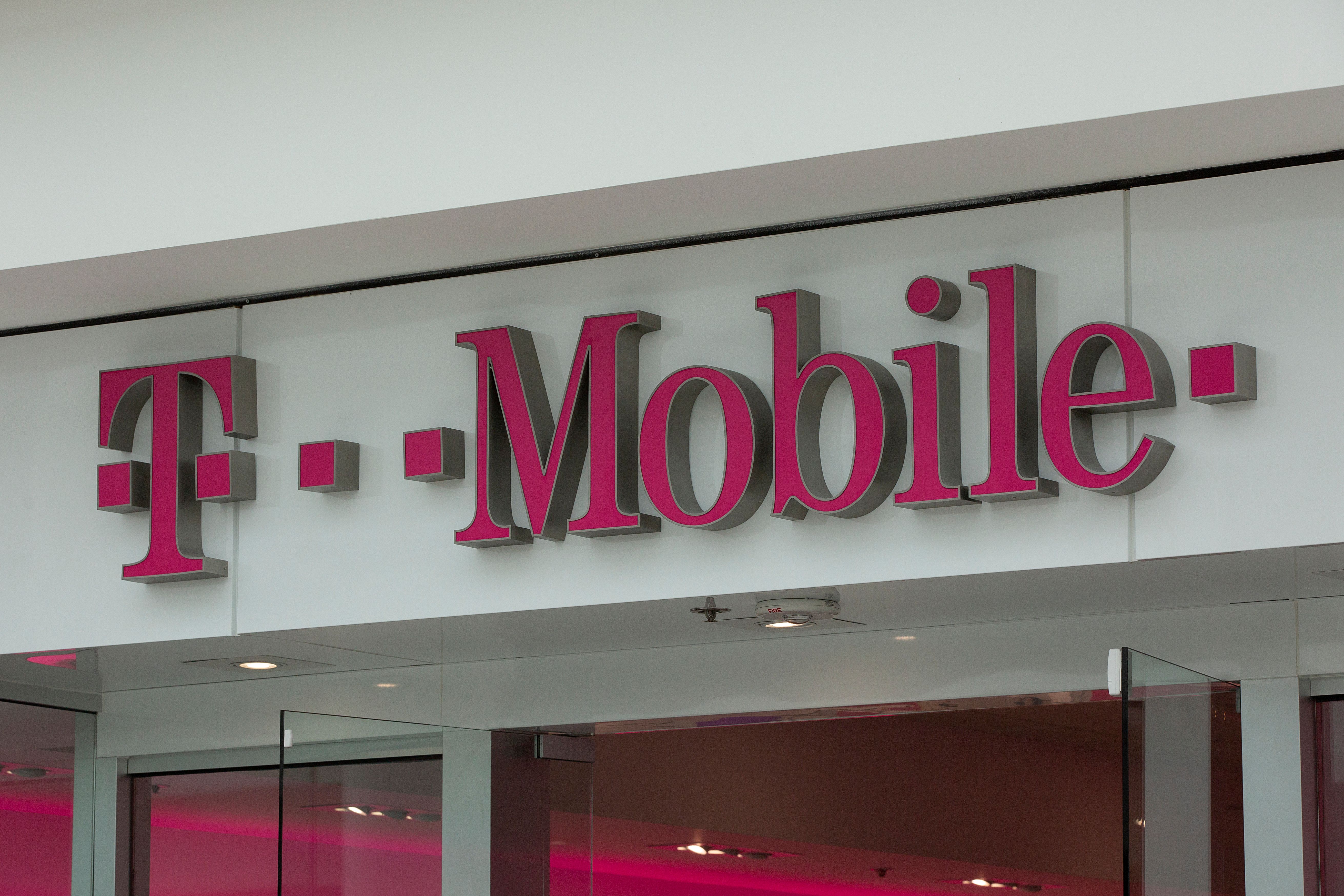 The T-Mobile logo is seen outside a shop in Washington, DC, on July 26, 2019. (ALASTAIR PIKE/AFP via Getty Images)