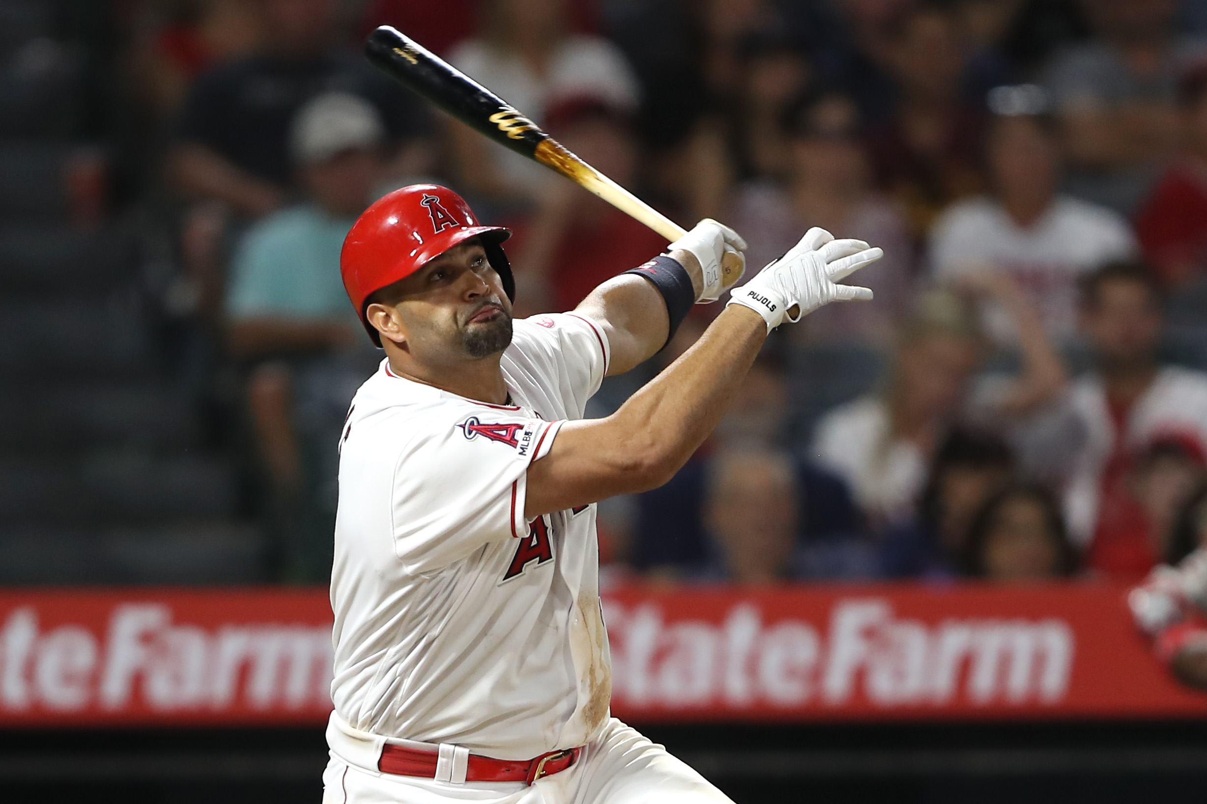 Albert Pujols of the Los Angeles Angels of Anaheim connects for a three-run homerun during the eighth inning of a game against the Boston Red Sox at Angel Stadium in Anaheim on August 31, 2019. (Sean M. Haffey/Getty Images)